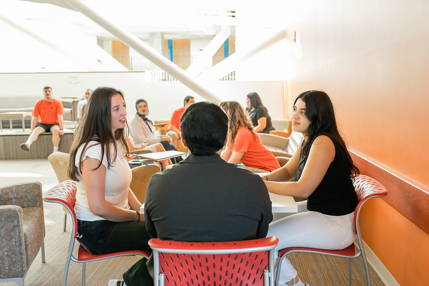 OSU school of pharmacy students talking around a table